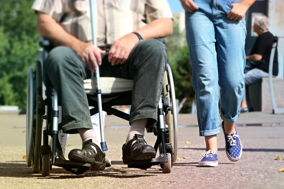 Wheelchair user on sidewalk